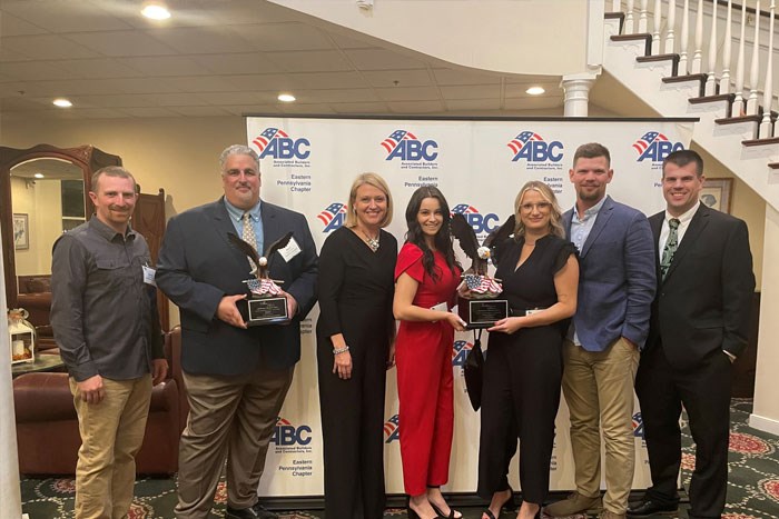 team members accept ABC award