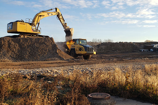 job site photo of excavator at work