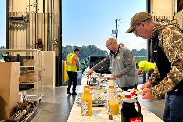 Photo of team members at a morning appreciation breakfast