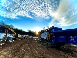 grinder in the field with snow
