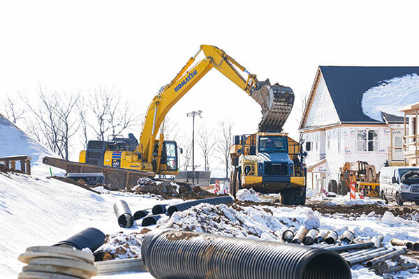 Skillfully loading pipe spoils