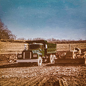 Historic Photo of Dump Truck on Job Site